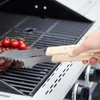 Kép 2/3 - Barbecook BC-ACC-7070 luxus rozsdamentes acél fogó, gumifa nyél, 100% FSC, 40cm