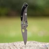 Kép 3/4 - True Utility Skeletonknife, TU571K, 4 cm rozsdamentes acél penge, eloxált alumínium tok, karabiner rögzítési pont, jobb és balkezes